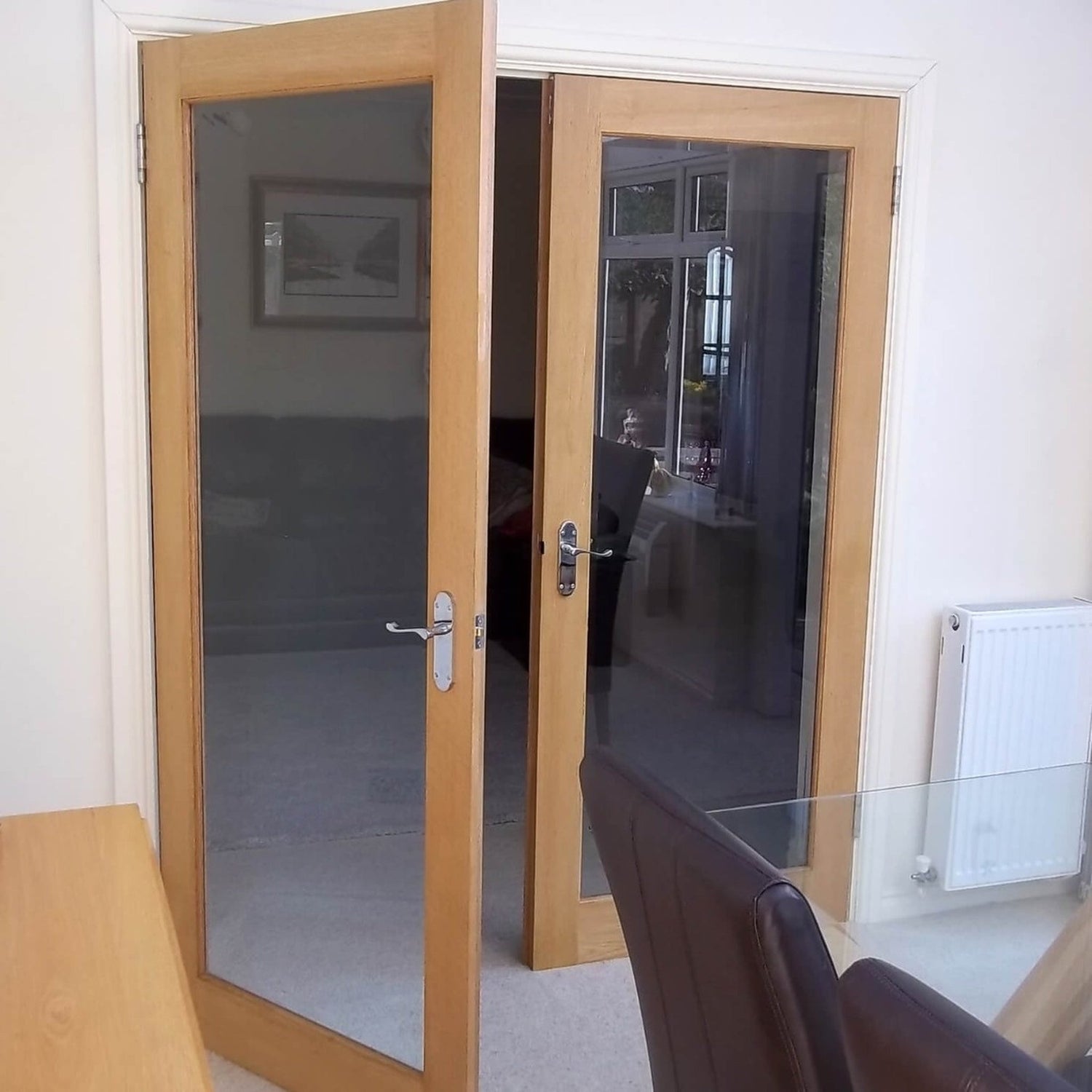 Pattern 10 Internal Glazed Oak French Internal Door - Lifestyle Image 1