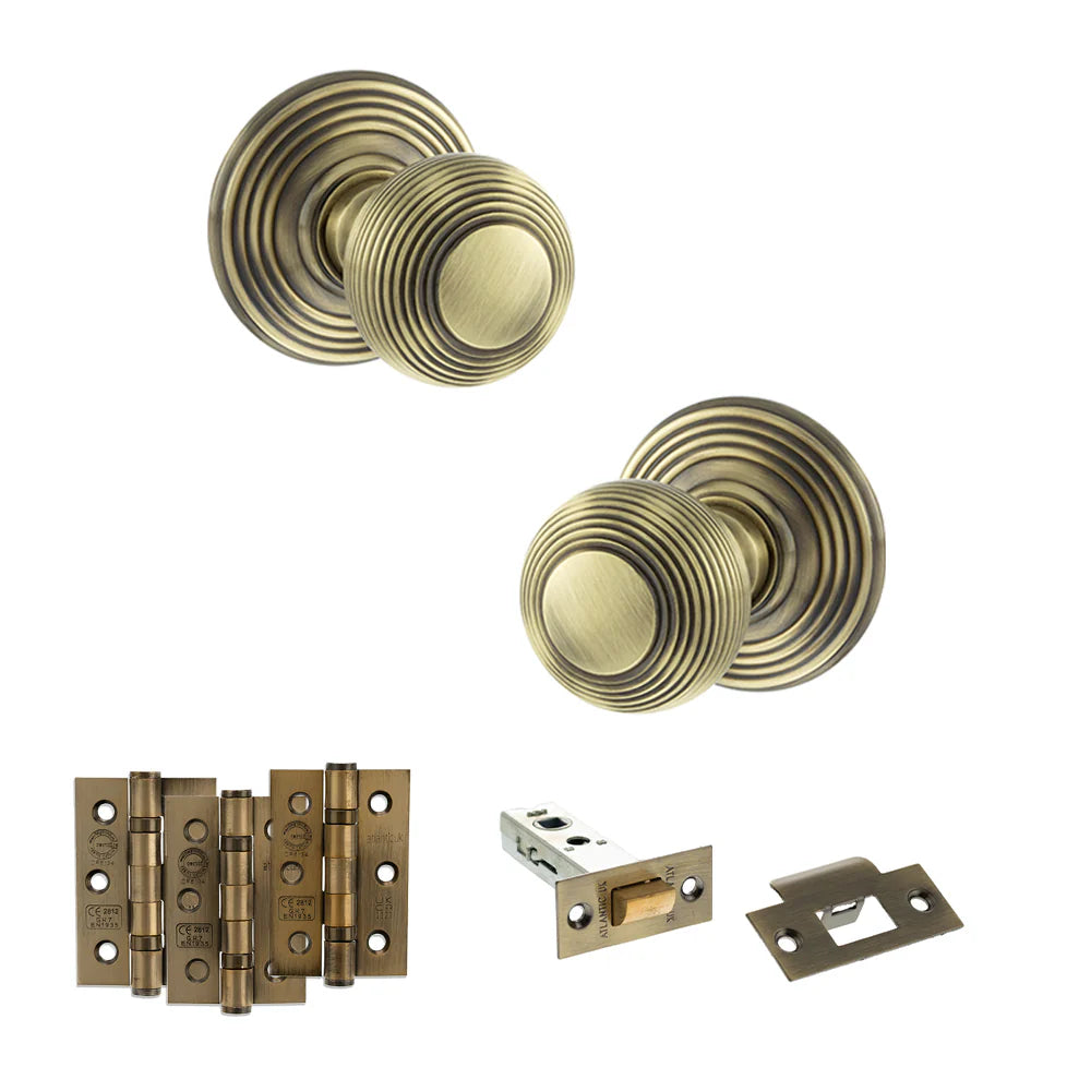 Product Old English Ripon antique brass reeded mortice door knob with matching hinges, latch and fixings