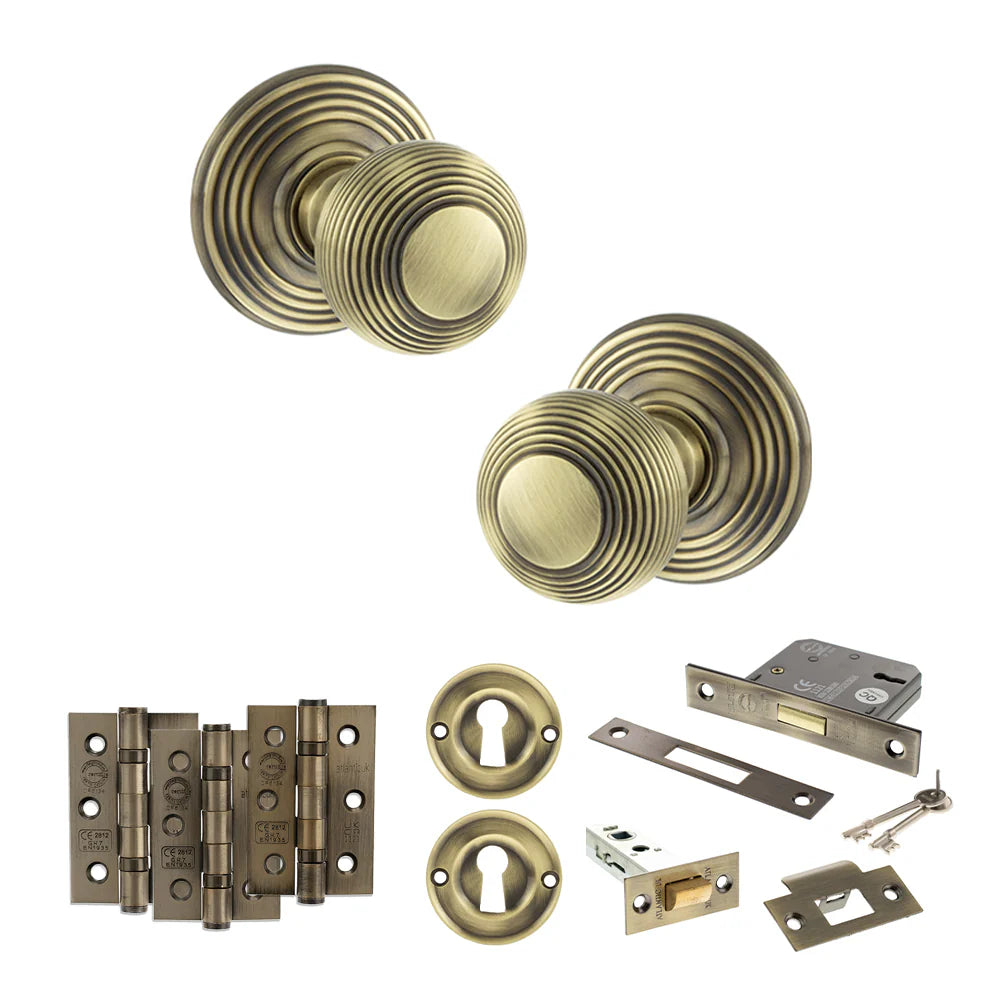 Product Old English Ripon antique brass reeded mortice door knob with matching hinges, latch and fixings