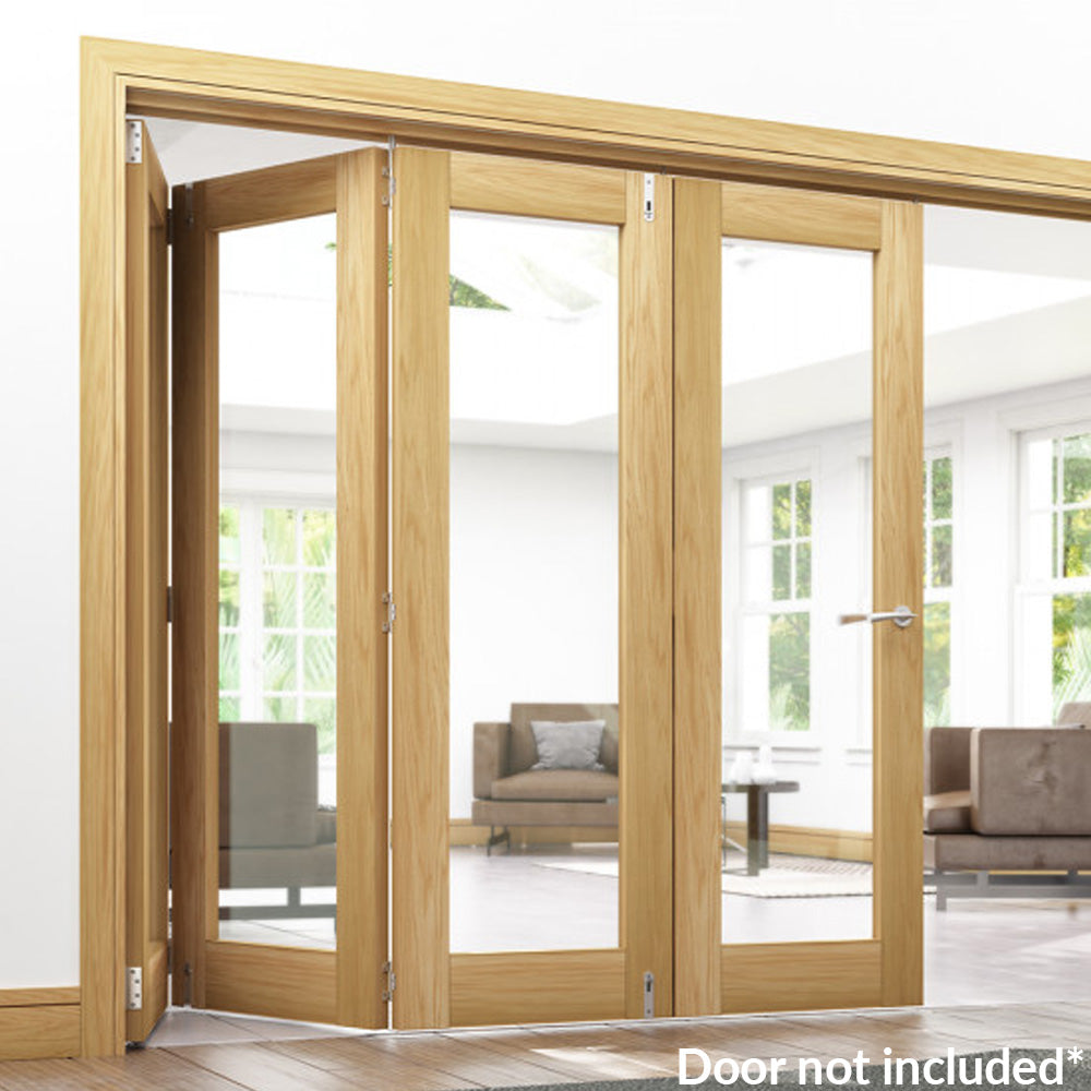 Lifestyle prefinished oak bifold frame kit with glazed folding doors in a bright room
