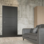 Lifestyle black Camden solid internal door in a bright room with pale walls
