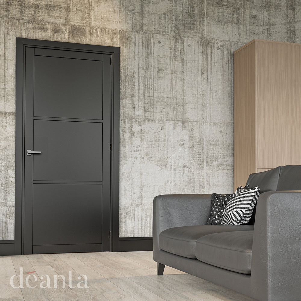 Lifestyle black Camden solid internal door in a bright room with pale walls