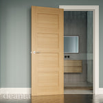 Lifestyle oak Coventry solid internal door in a light room with traditional panel styling