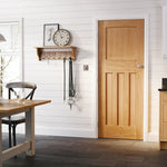 Lifestyle oak DX30 1930s-style fire door installed in a home interior