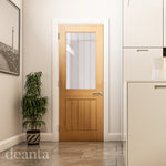 Lifestyle oak Ely one-light clear glazed internal door in a bright room with natural wood tones