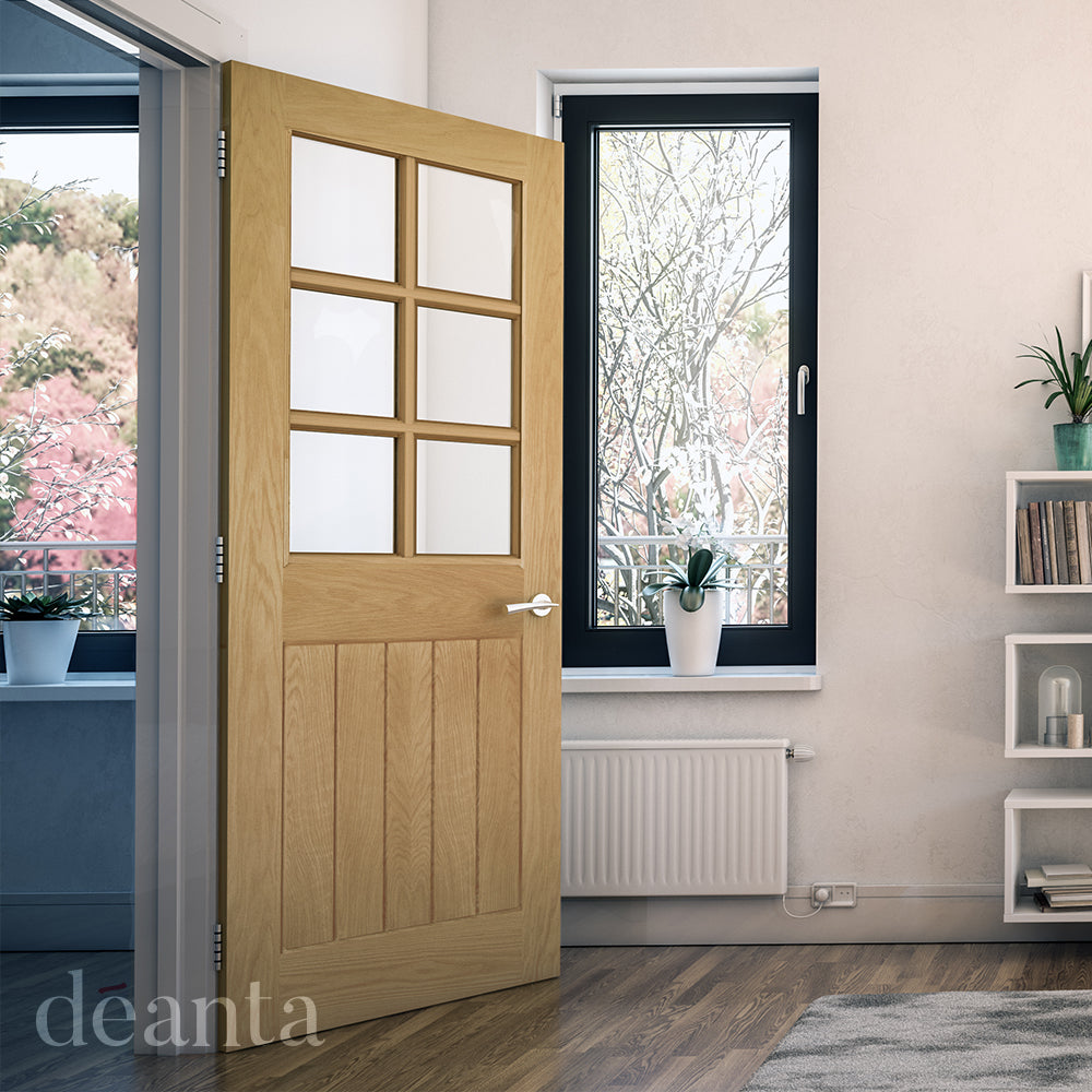 Lifestyle oak internal door with six clear glazed panels in a room setting