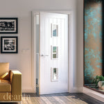Lifestyle white primed door with clear glazed panel in a bright interior