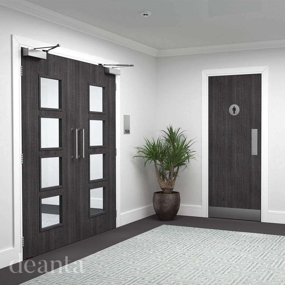 Dark grey ash flush fire door in a bright room