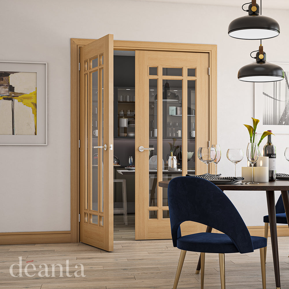 Lifestyle oak Kerry clear glazed internal door installed in a hallway