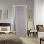 Lifestyle light grey Vancouver five-panel internal door in a bedroom with grey walls