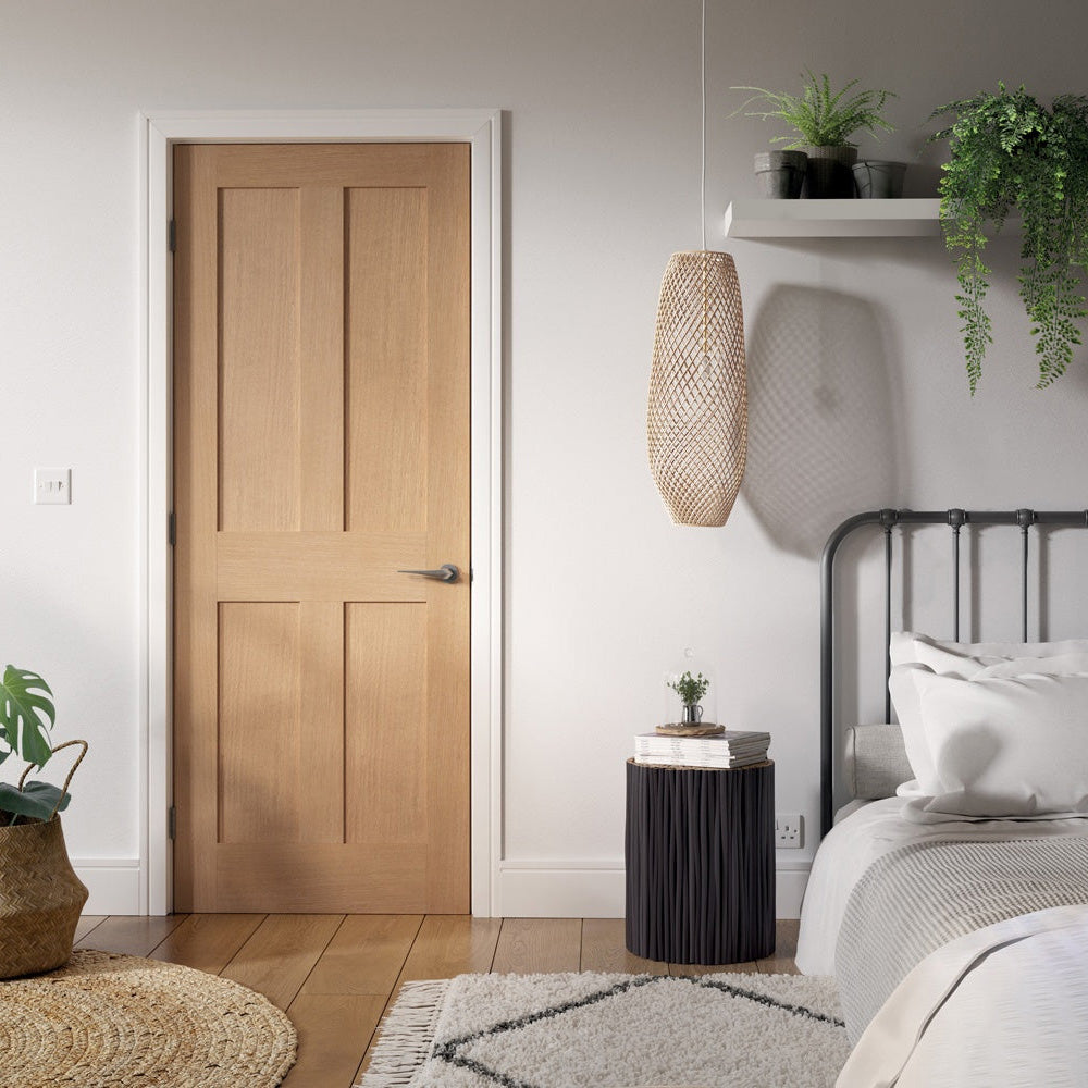 Lifestyle prefinished oak London four-panel FD30 fire door installed in a home interior