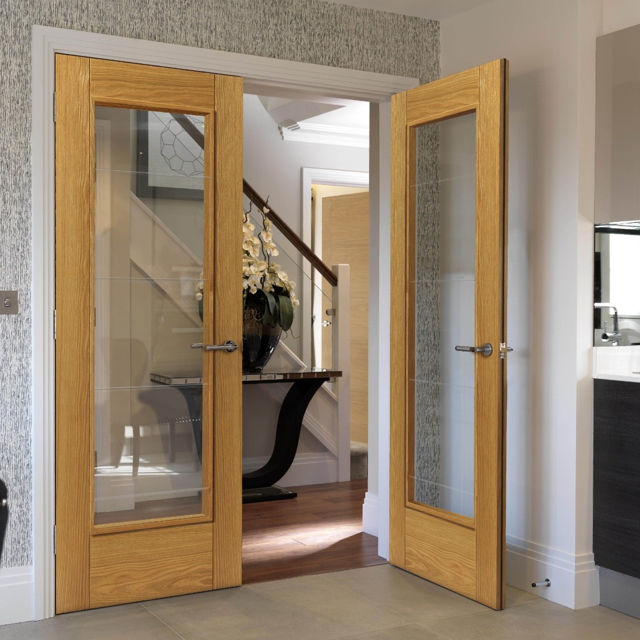 Lifestyle Medina prefinished oak etched glazed internal door installed in a room
