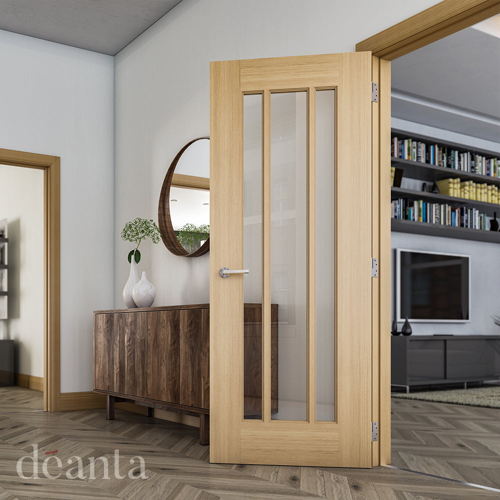Lifestyle oak Norwich clear glazed internal door in a bright home interior with neutral walls