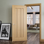 Lifestyle Norwich oak internal door with three recessed panels in a living room setting
