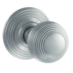 A pair of round silver door knobs with concentric ring detailing, shown on a plain white background.