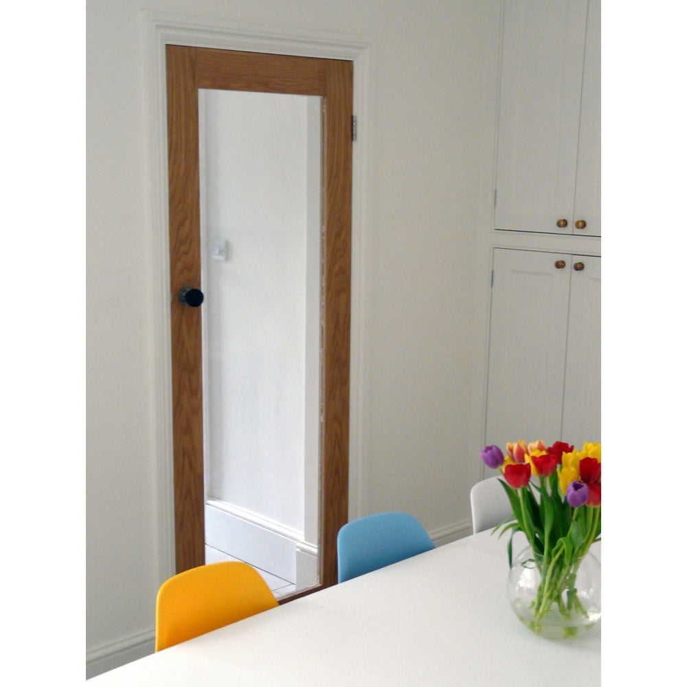 Lifestyle oak veneer one-light glazed internal French door installed in a room