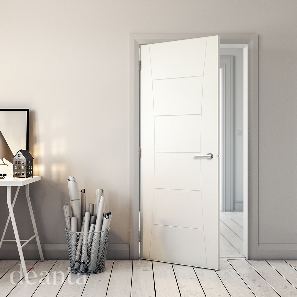 Lifestyle white primed Pamplona solid internal door in a bright room with pale walls