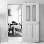 Lifestyle white primed glazed internal door in a bright interior