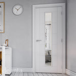 Lifestyle white primed Seville clear glazed internal door in a bright room with soft neutral decor