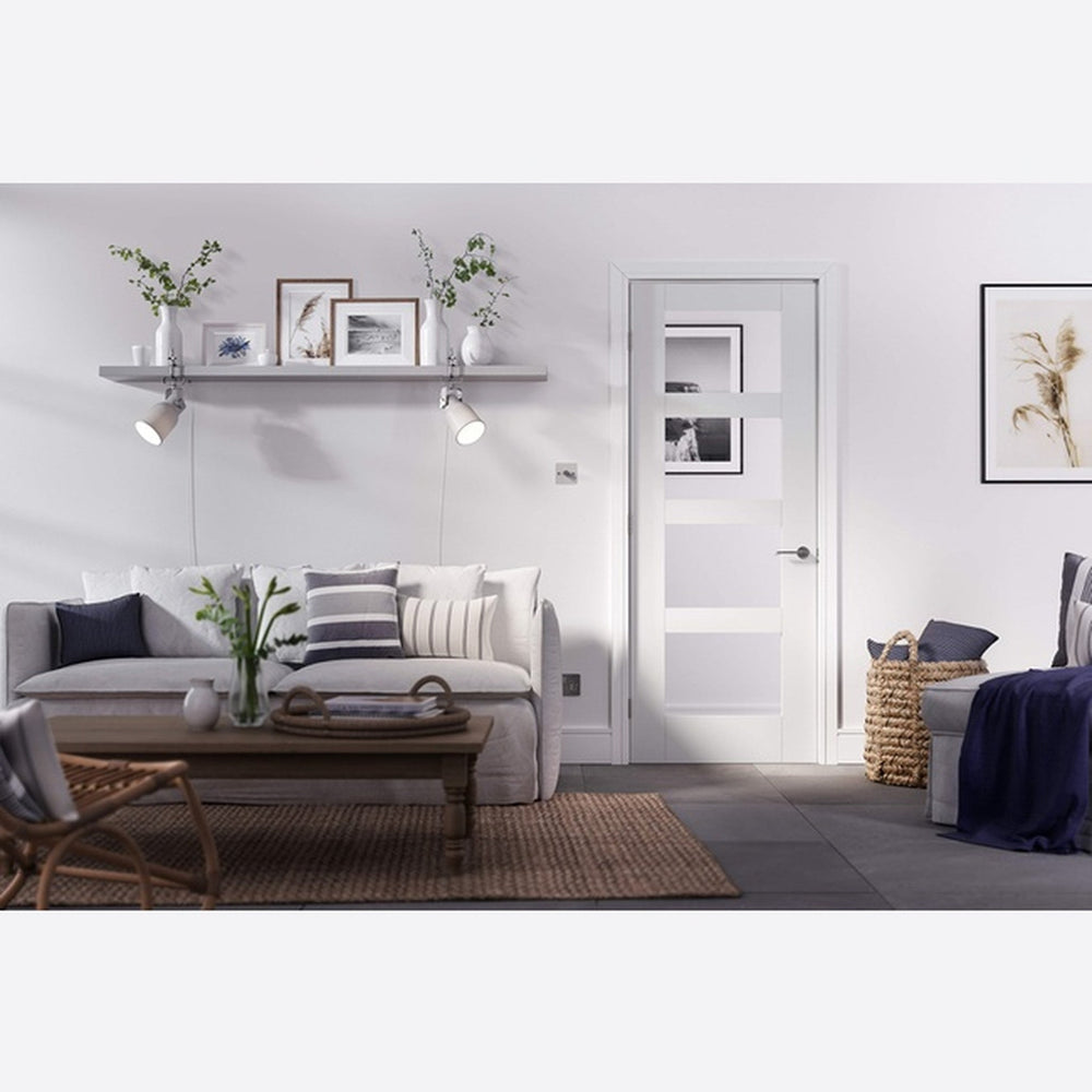 Lifestyle shaker white primed four-light glazed internal door in a room setting
