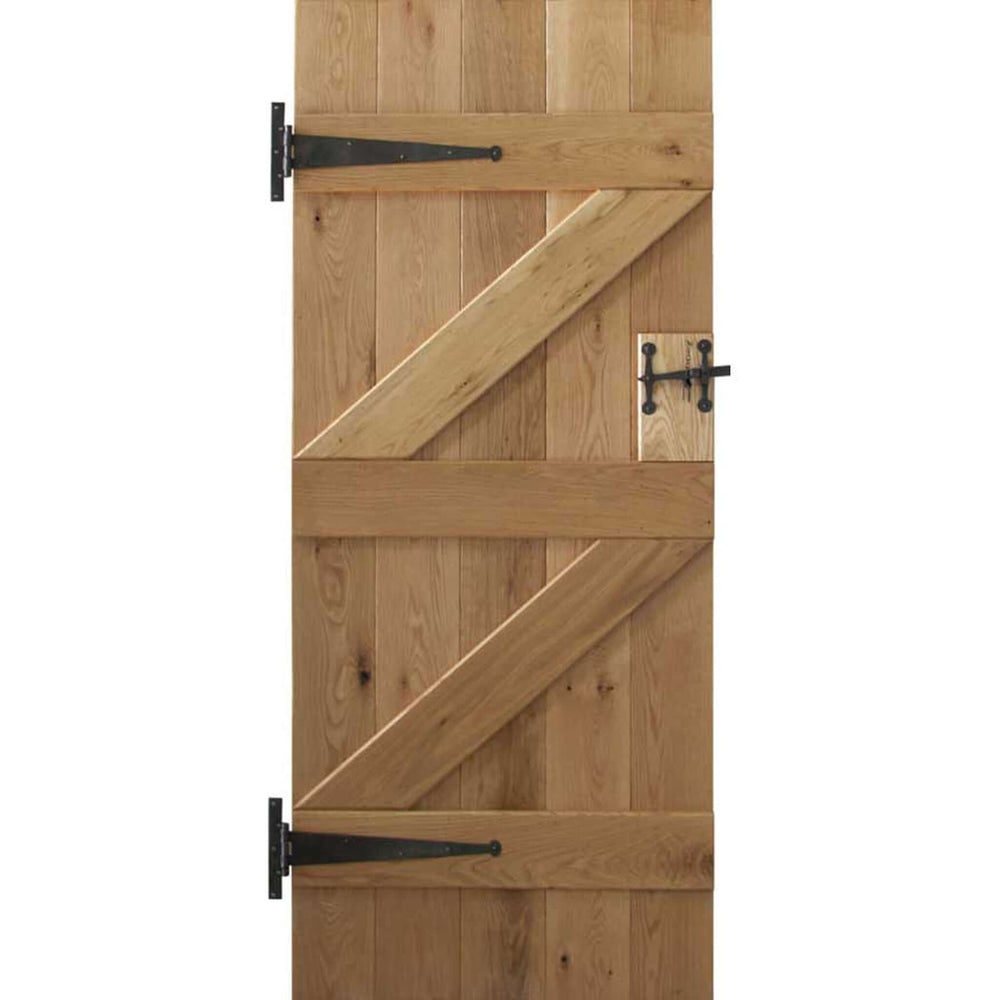 Product solid oak ledge and braced rustic V groove door on white background