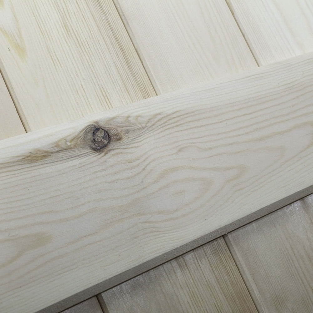 Lifestyle solid pine three-ledge V-groove internal door installed in a rustic room