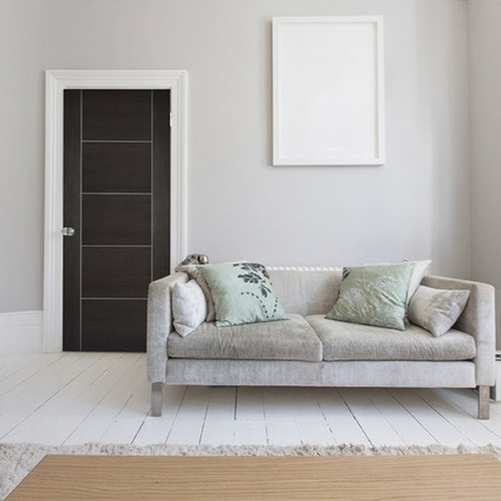 Lifestyle dark grey Vancouver laminate FD30 fire door in a living room setting