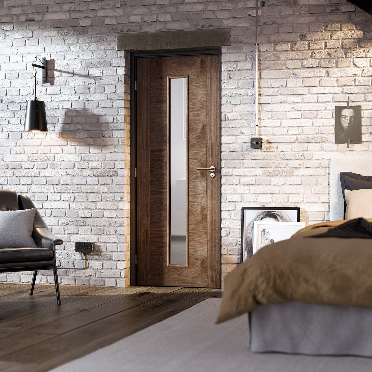 Lifestyle walnut Sofia one-light glazed internal door in an exposed brick bedroom