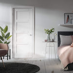 Lifestyle white Shaker four-panel internal door in a modern room setting