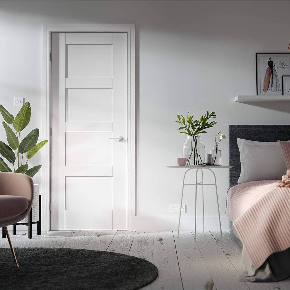 Lifestyle white Shaker four-panel internal door in a modern room setting
